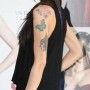 Tatuaggio farfalla sul braccio per Virginie Marsan