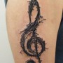 Foto tatuaggio chiave di violino sul braccio