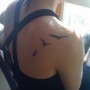 Immagine tatuaggio uccelli che volano