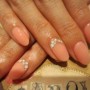 Nail art color corallo con strass