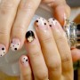 Nail art con tip corte a pois inverno 2013