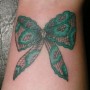 Foto tatuaggio fiocco in pizzo