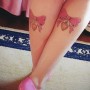 Immagini fiocchi tatuati sui polpacci