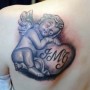 Tatuaggio angelo custode con lettere
