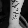 Tatuaggio pipistrelli interno polso